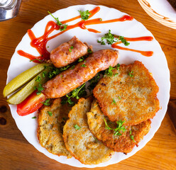 belarusian pancakes with sausages in a restaurant