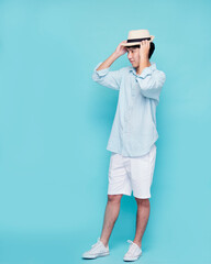 Fototapeta premium Handsome men tourists wear summer hat