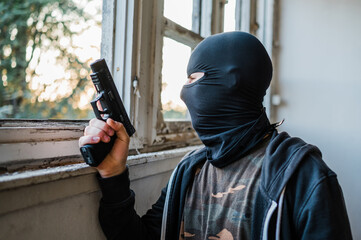 Man reenacting special unit of Croatian military police. Wearing green jumpsuit with black add-ons...