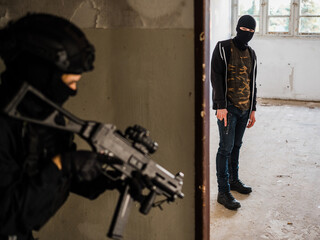 Man reenacting special unit of Croatian military police. Wearing green jumpsuit with black add-ons...