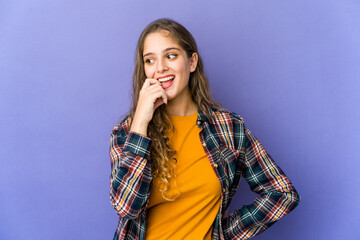 Young caucasian cute woman relaxed thinking about something looking at a copy space.