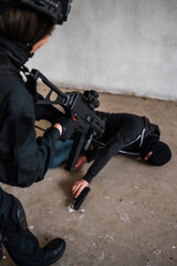 Man reenacting special unit of Croatian military police. Wearing green jumpsuit with black add-ons...