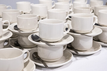 Fototapeta na wymiar catering, many small white cups with spoons