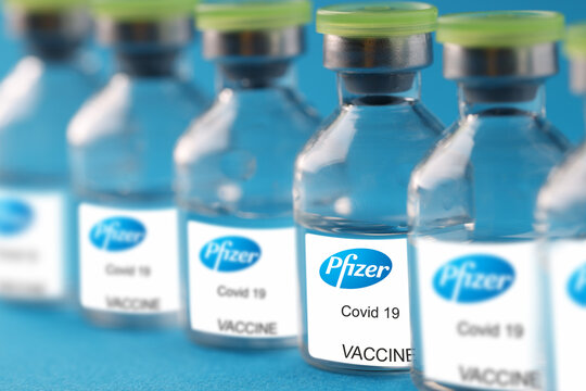 Glass Vial With Coronavirus Covid 19 Vaccine From Pfizer Closeup