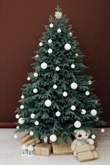New Year's Red Christmas Tree decor with gifts and garlands interior