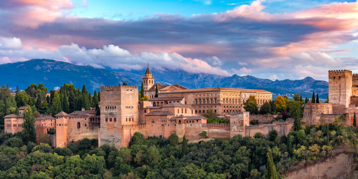 Palace and fortress complex Alhambra with Comares Tower, Palacios Nazaries and Palace of Charles V during sunset in Granada, Andalusia, Spain