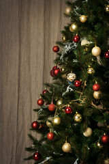 Christmas tree with white and red balls on linen fabric background