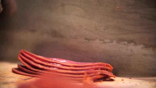 Close Shot of Man Slicing Turkish Pastrami At Food Market in Istanbul 50fr