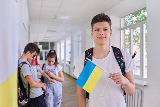 Teenager Student With Ukraine Flag, School Corridor Group Of Students Background