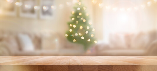 A wood table, tabletop product display with a festive Christmas background of Christmas tree and...