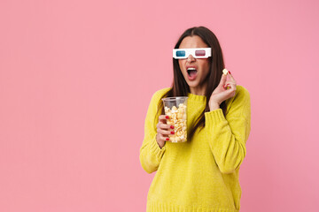 Shocked nice girl in 3d glasses watching movie and eating popcorn