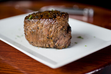 Steak. Grass-fed skirt steak, grilled to a medium rare and served with a garlic herb butter sauce and paired with roasted potatoes and Brussels sprouts. Classic American steakhouse favorite.