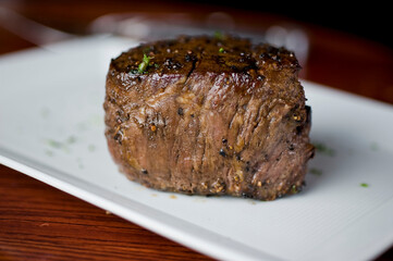 Steak. Grass-fed skirt steak, grilled to a medium rare and served with a garlic herb butter sauce and paired with roasted potatoes and Brussels sprouts. Classic American steakhouse favorite.