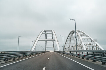Obraz premium Empty highway with asphalt road and cloudy sky