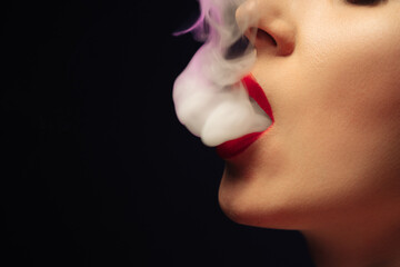 Beautiful girl Smoking hookah on black background