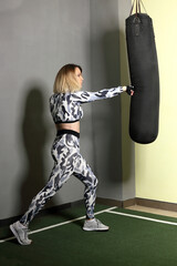 Blonde woman boxing training in the gym