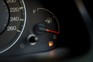 Empty fuel warning light in car dashboard. Fuel pump icon. gasoline gauge dash board in car with...