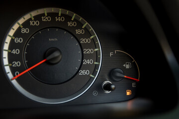 Empty fuel warning light in car dashboard. Fuel pump icon. gasoline gauge dash board in car with...