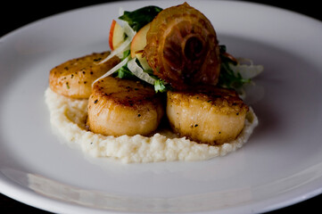 Scallops sautéed in olive oil, topped with crushed almonds, garnished w/ scallions, parsley & served with organic vegetables. Classic Italian, American restaurant or French bistro entree.
