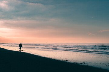 OOstduinkerke, Belgium - November 5, 2020: Beach walk at sunset