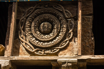Wooden carvings on the walls of an ancient Hindu temple