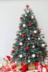 Christmas tree decor pine with gifts and garlands interior new year