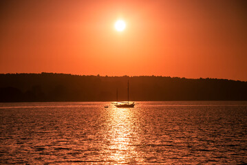 A yacht on the River Orwell at sunrise in Suffolk, UK