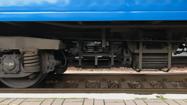 the train starts moving, the wheels of the train, train wagon, train arrives, train parking, railway, station, railway station.