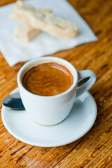 Cappuccino. Fresh cup of dark French roast shot of espresso w/ steamed milk. Classic American. French bistro, coffee house or café beverage. Typical drink served at breakfast. white background