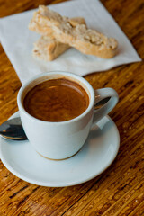 Cappuccino. Fresh cup of dark French roast shot of espresso w/ steamed milk. Classic American. French bistro, coffee house or café beverage. Typical drink served at breakfast. white background
