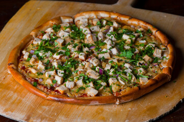 Pizza. Hand rolled pizza dough, topped with homemade tomato sauce seasoned with garlic, basil leaves salt and peppers. Topped with pepperoni and shredded mozzarella cheese then baked to a golden crisp