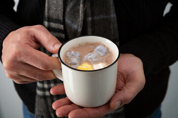 Cup of hot chocolate in hands