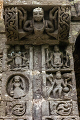 Fototapeta na wymiar Ancient stone carvings on the walls of a HIndu temple