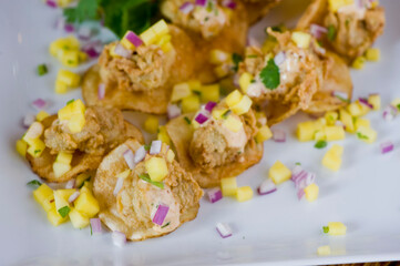 Fried oysters. Fresh oysters fried and served with garlic, shallots, cocktail sauce, mignonette sauce and fresh lemons and limes. Classic American steakhouse or French bistro appetizer.