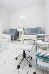 Interior of modern manicure salon without people. Luxury work places for masters of pedicure
