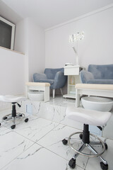 Interior of modern manicure salon without people. Luxury work places for masters of pedicure