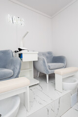 Interior of modern manicure salon without people. Luxury work places for masters of pedicure