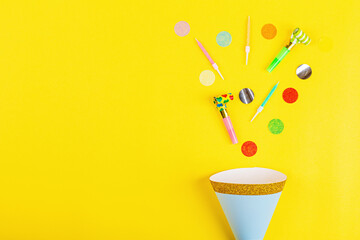 Birthday decor on yellow background, top view. Flat lay style. Mockup, template