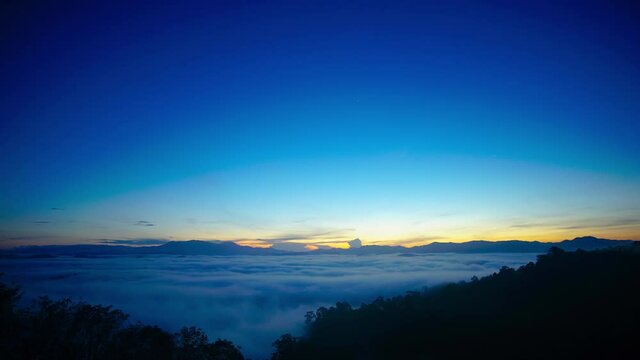Nature video Amazing scene of Time lapse of sunrise and mist in morning at Doi pha tang, Chiang rai, Thailand. Nature and travel concept.