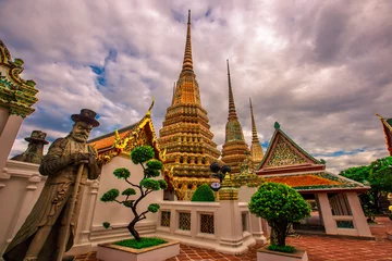 Deurstickers background of important religious attractions in Bangkok (Wat Phra Chetuphon (Wat Pho - reclining Buddha), a large pagoda and beautiful sculptural art give future generations to explore its history © bangprik