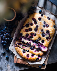 Florentine grape bread (Schiacciata con l'uva), a sweet focaccia typical of Tuscany. Top view, wooden background.