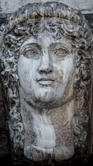 Fototapeta na wymiar Ancient aged sculpture of beautiful Venetian Renaissance Era woman in Venice, Italy
