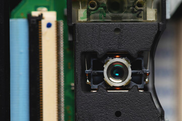 Close-up of a laser lens for reading and writing dvd roma cd drive. Readout optical design