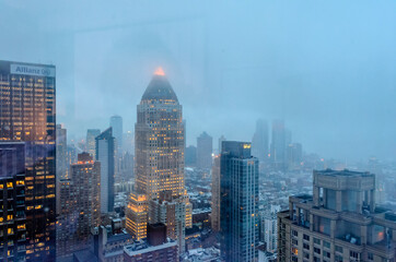 Naklejka premium Buildings, Skyscrapers and Towers in Manhattan on a Foggy Evening of Winter. Aerial View of New York City, USA