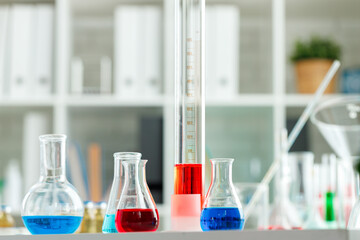 Laboratory glassware with color liquids close up