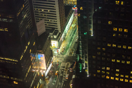Fototapeta High Angle View of Manhattan Avenues. Tiny vehicles Moving, Traffic, Street Lights as Seen from the 48th Floor of a Skyscraper. New York City, USA