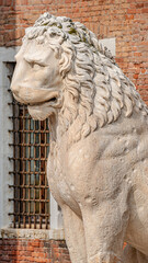Ancient Venetian Piraeus lion head near Arsenal in Venice, Italy, closeup, details