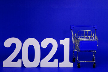 2021 Shopping Cart on blue background - new year 2021 - Business Shopping stores to buy goods...