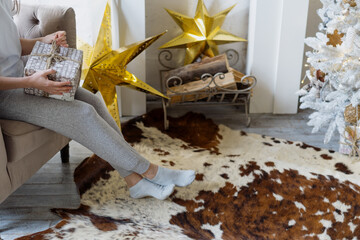 Woman with christmas gift box in hands