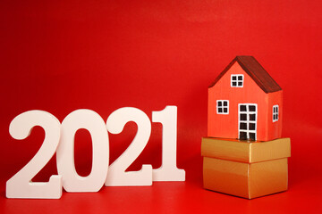 Home Property 2021 , 2021 number wood with House model on red pattern background - home new year - red concept of Real Estate, Property for Sale and rent